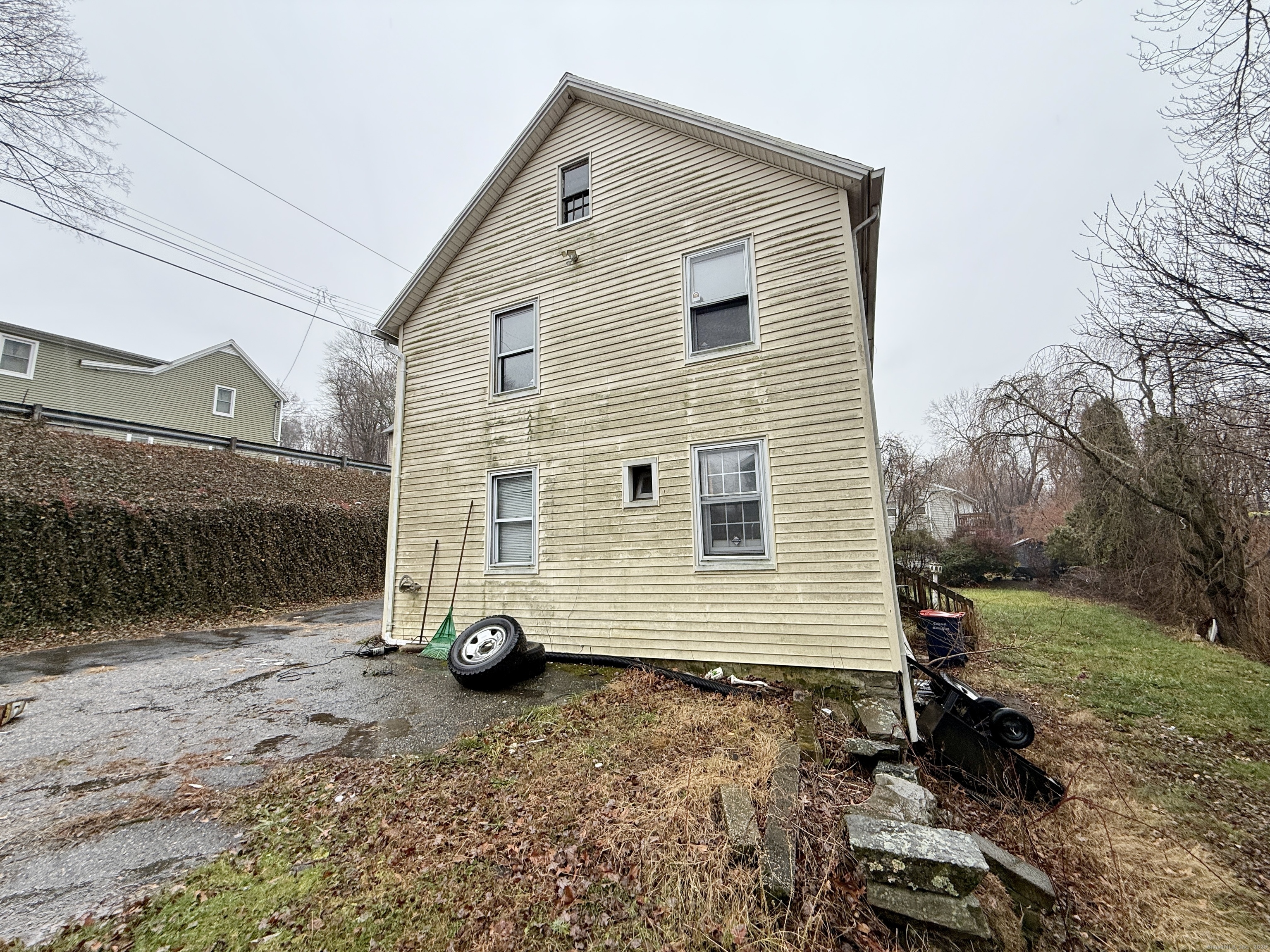 201 Prospect Street Ansonia, CT 06401 - Photo 5 of 28 a view of a house with a yard