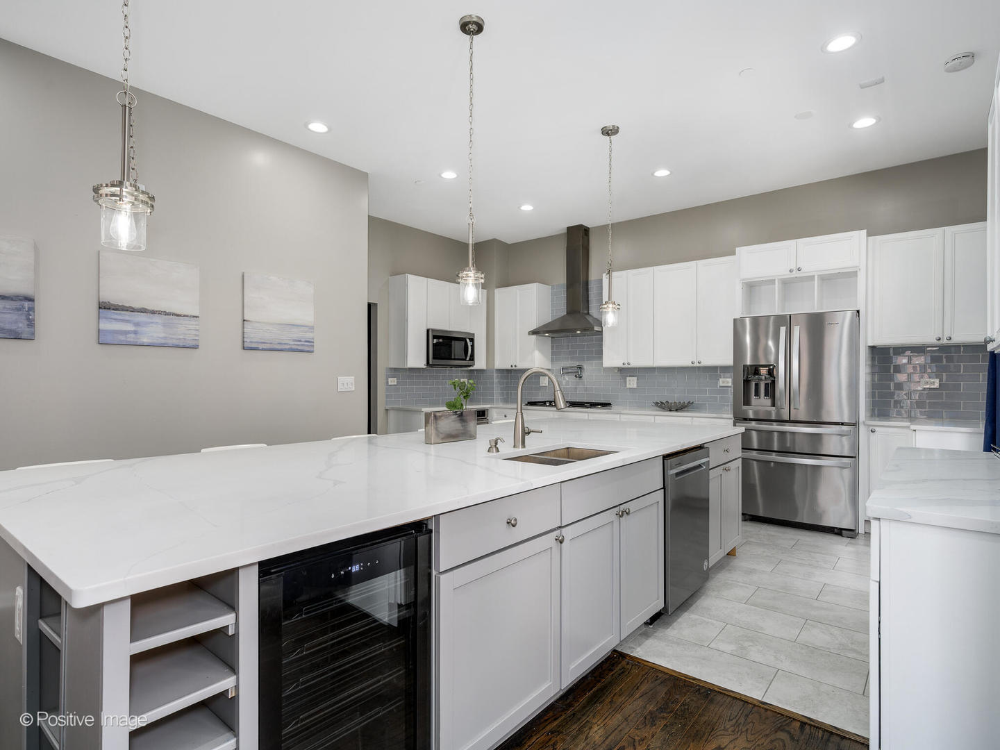 910 West Village Court Chicago, IL 60608 - Photo 14 of 44 a kitchen with kitchen island a sink appliances and cabinets