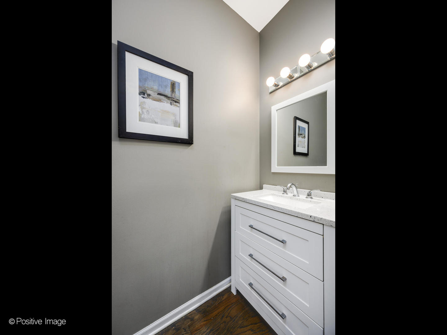 910 West Village Court Chicago, IL 60608 - Photo 19 of 44 a bathroom with a sink a vanity and mirror