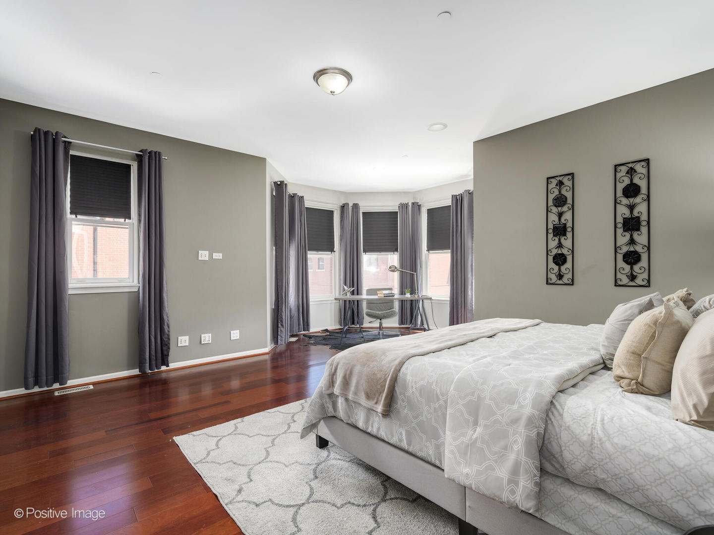 910 West Village Court Chicago, IL 60608 - Photo 20 of 44 a bedroom with a large bed and a wooden floor