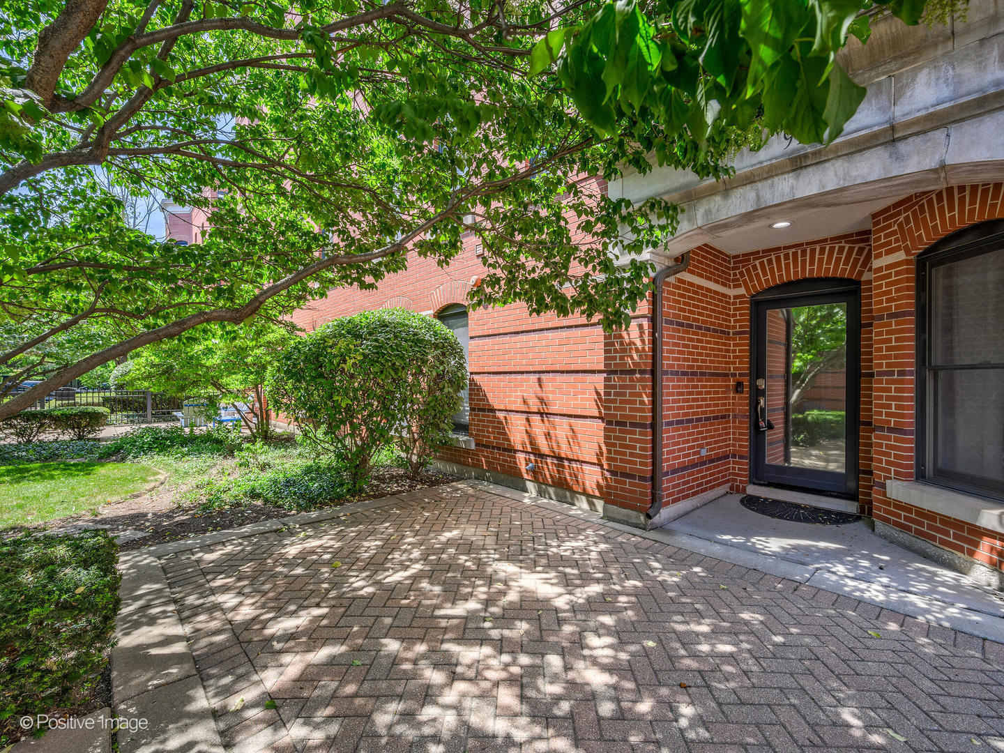 910 West Village Court Chicago, IL 60608 - Photo 2 of 44 a view of a house with a yard