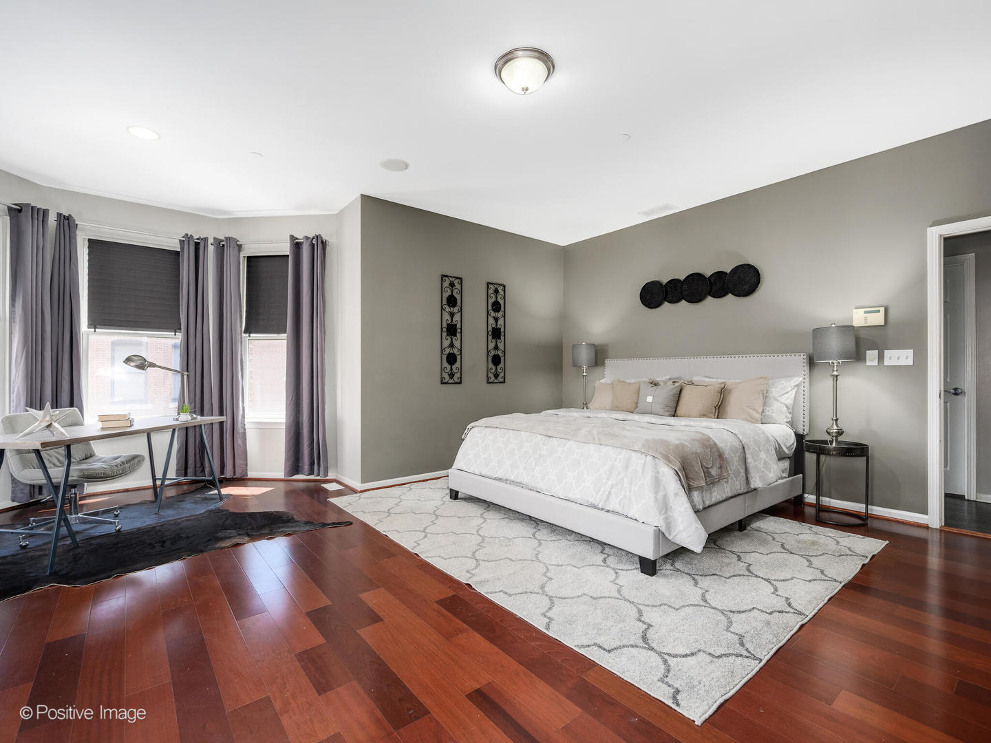 910 West Village Court Chicago, IL 60608 - Photo 21 of 44 a bedroom with a large bed and a large window