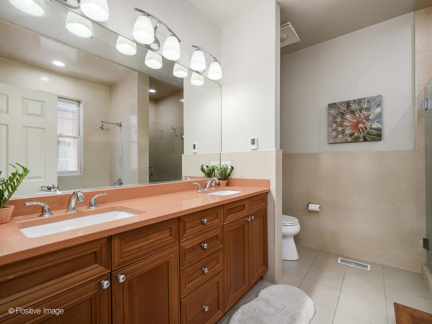910 West Village Court Chicago, IL 60608 - Photo 22 of 44 a bathroom with a granite countertop sink mirror and toilet