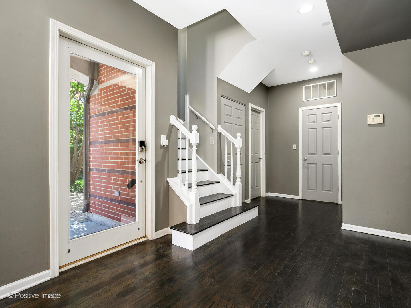 910 West Village Court Chicago, IL 60608 - Photo 3 of 44 a view of an entryway with wooden floor and door