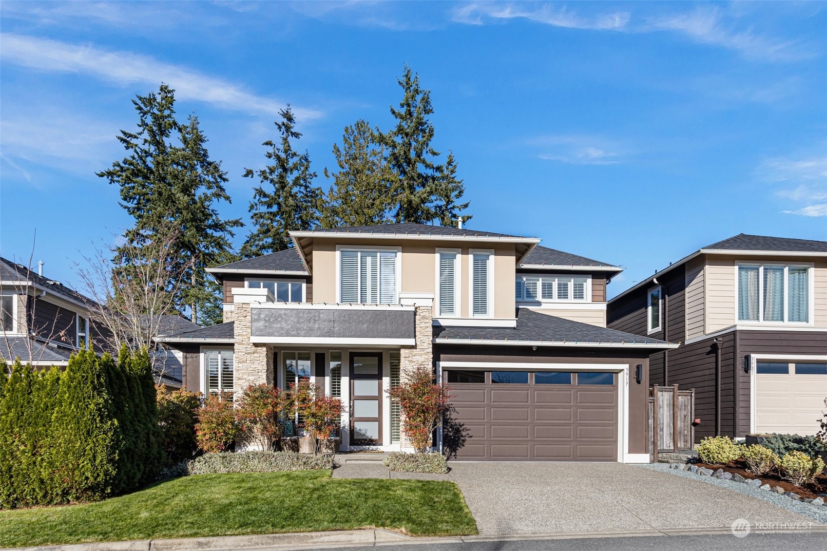 3917 171st Street Southeast Bothell, WA 98012 - Photo 1 of 33 a front view of a house with garden