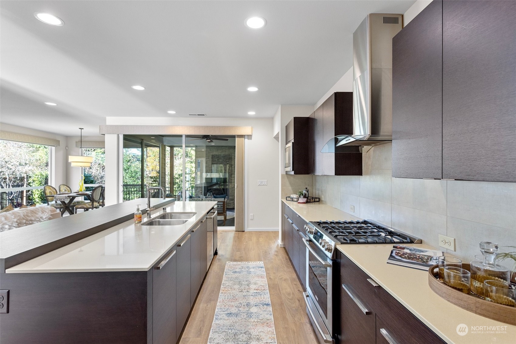 3917 171st Street Southeast Bothell, WA 98012 - Photo 14 of 33 a large kitchen with stainless steel appliances granite countertop a lot of counter space and a sink