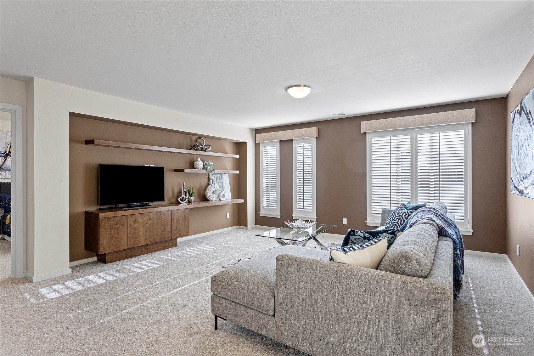 3917 171st Street Southeast Bothell, WA 98012 - Photo 20 of 33 a living room with furniture and a flat screen tv