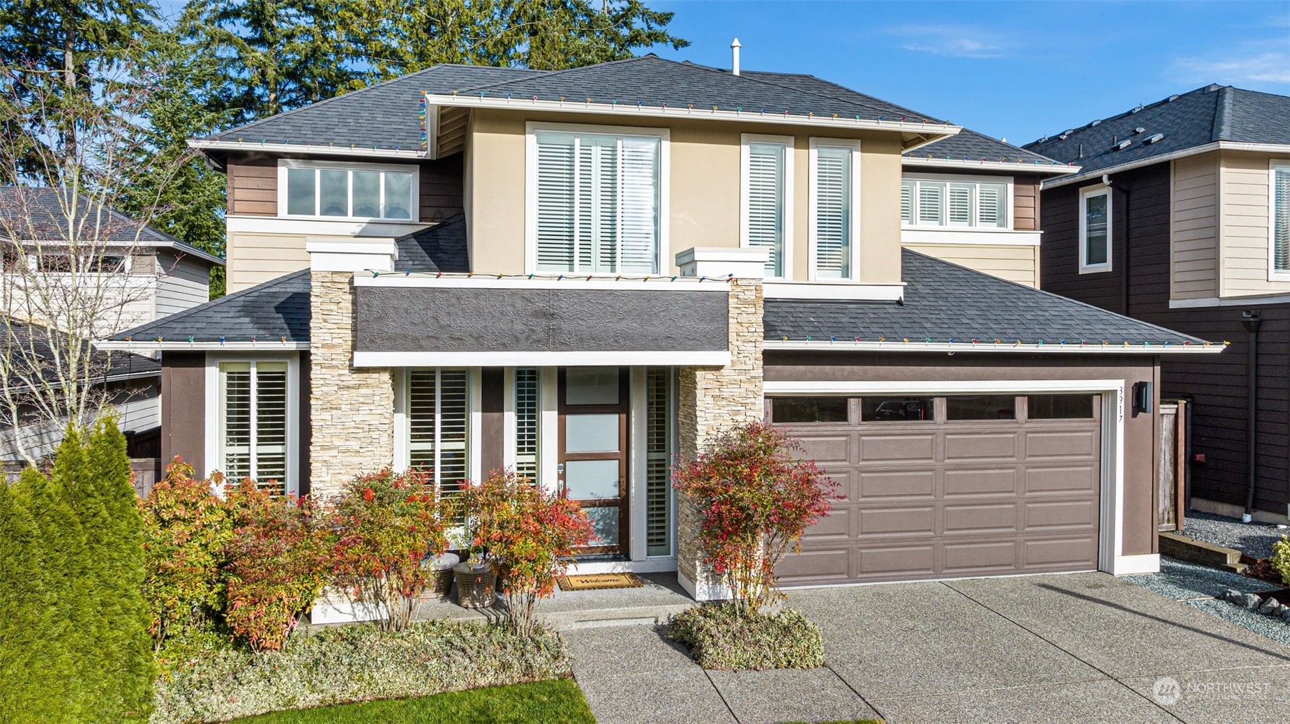 3917 171st Street Southeast Bothell, WA 98012 - Photo 2 of 33 a front view of a house with garden