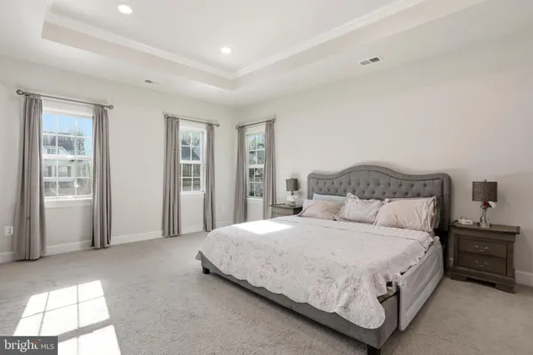 a bedroom with bed and a dresser