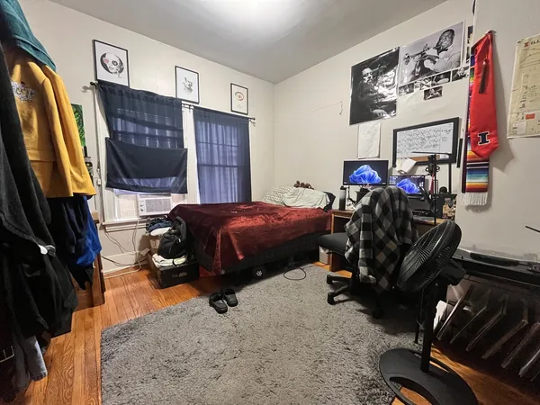 a bed room with a bed and a television