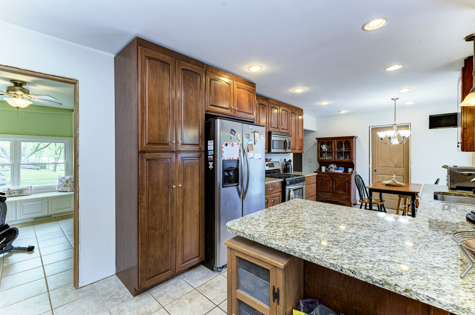 336 Hadleigh Road Bolingbrook, IL 60440 - Photo 14 of 24 a kitchen with stainless steel appliances granite countertop a refrigerator and a sink