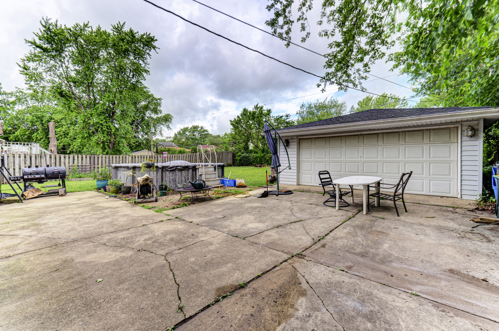 336 Hadleigh Road Bolingbrook, IL 60440 - Photo 22 of 24 a view of backyard with a table and chairs under an umbrella