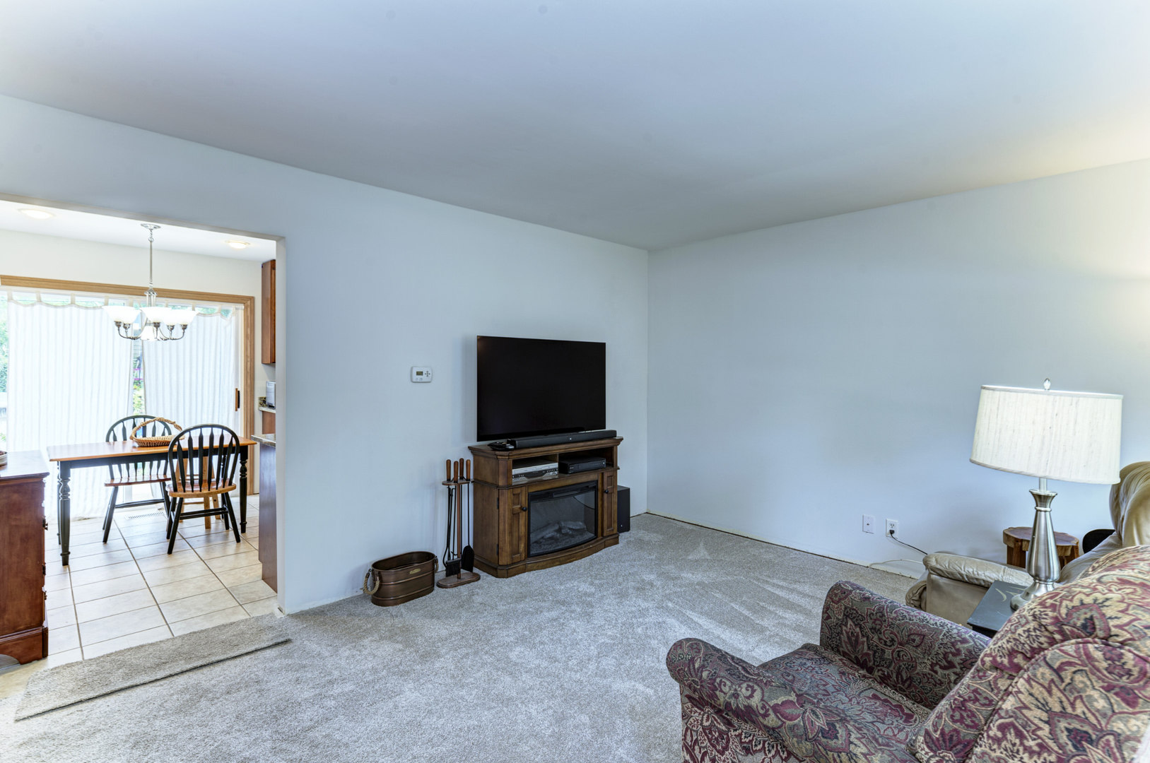 336 Hadleigh Road Bolingbrook, IL 60440 - Photo 4 of 24 a bedroom with furniture and a flat screen tv
