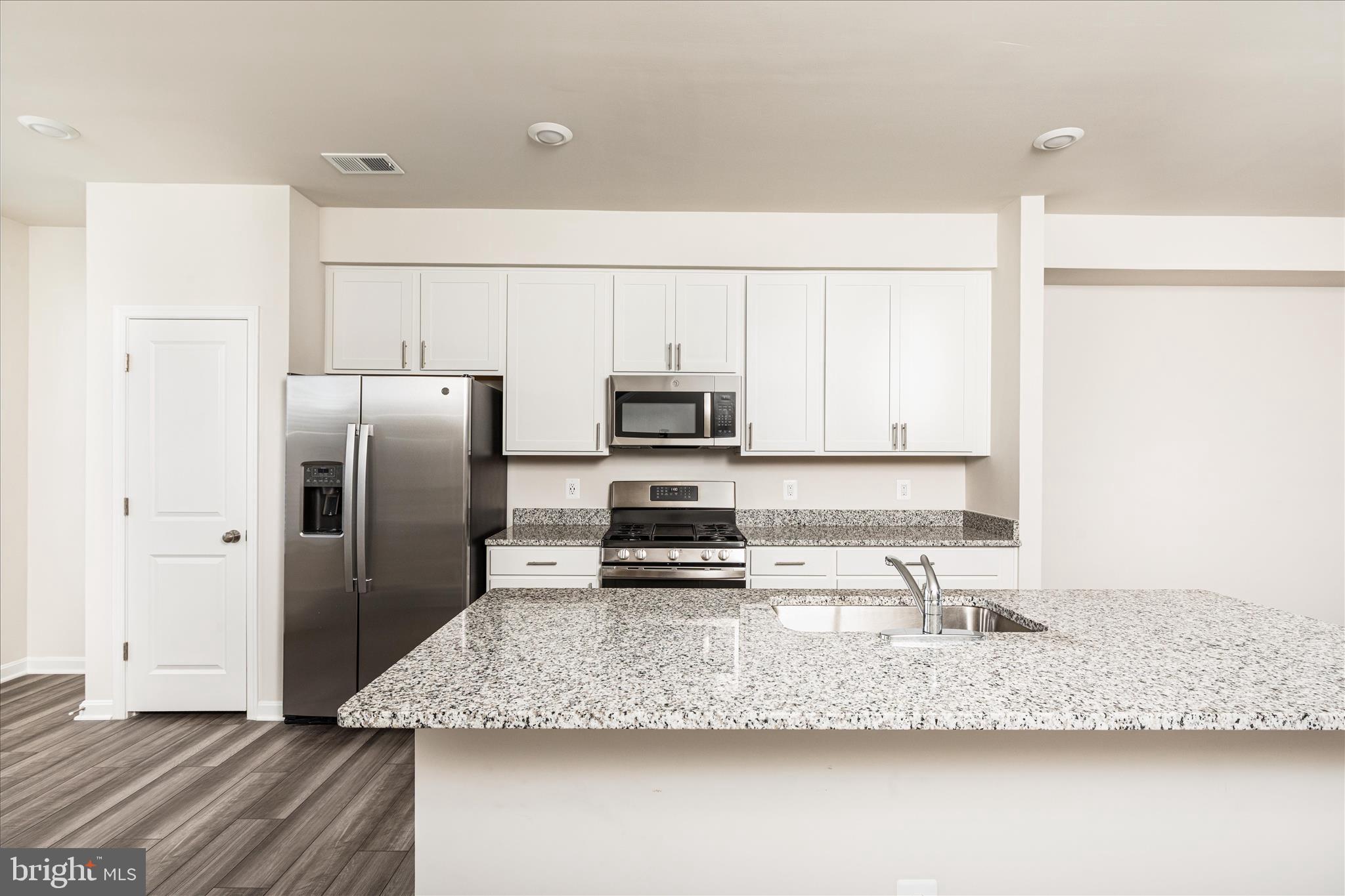 140 Tye Court Winchester, VA 22602 - Photo 17 of 31 a kitchen with stainless steel appliances granite countertop a sink a refrigerator and a granite counter tops