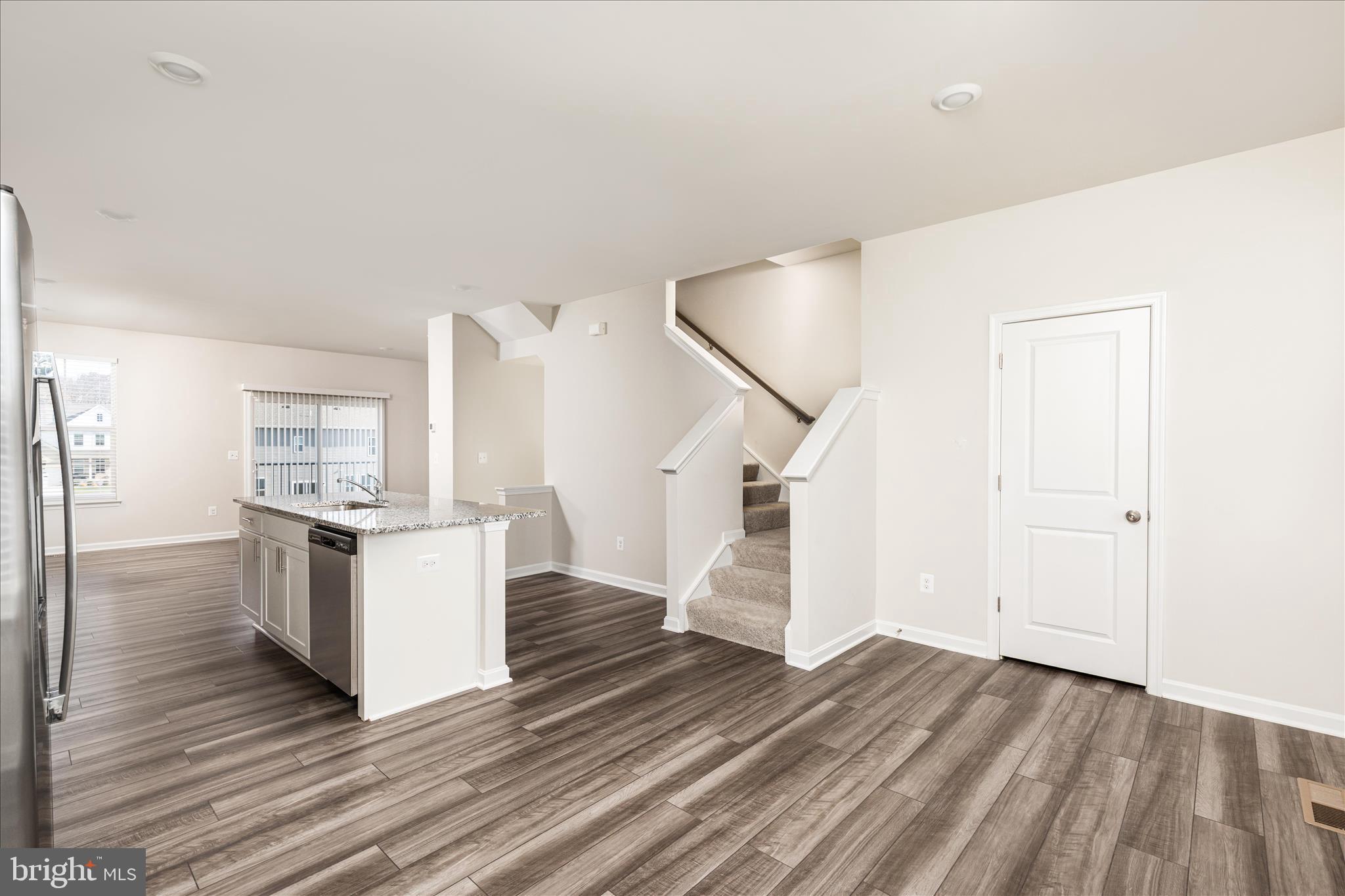 140 Tye Court Winchester, VA 22602 - Photo 2 of 31 a kitchen with cabinets and wooden floor