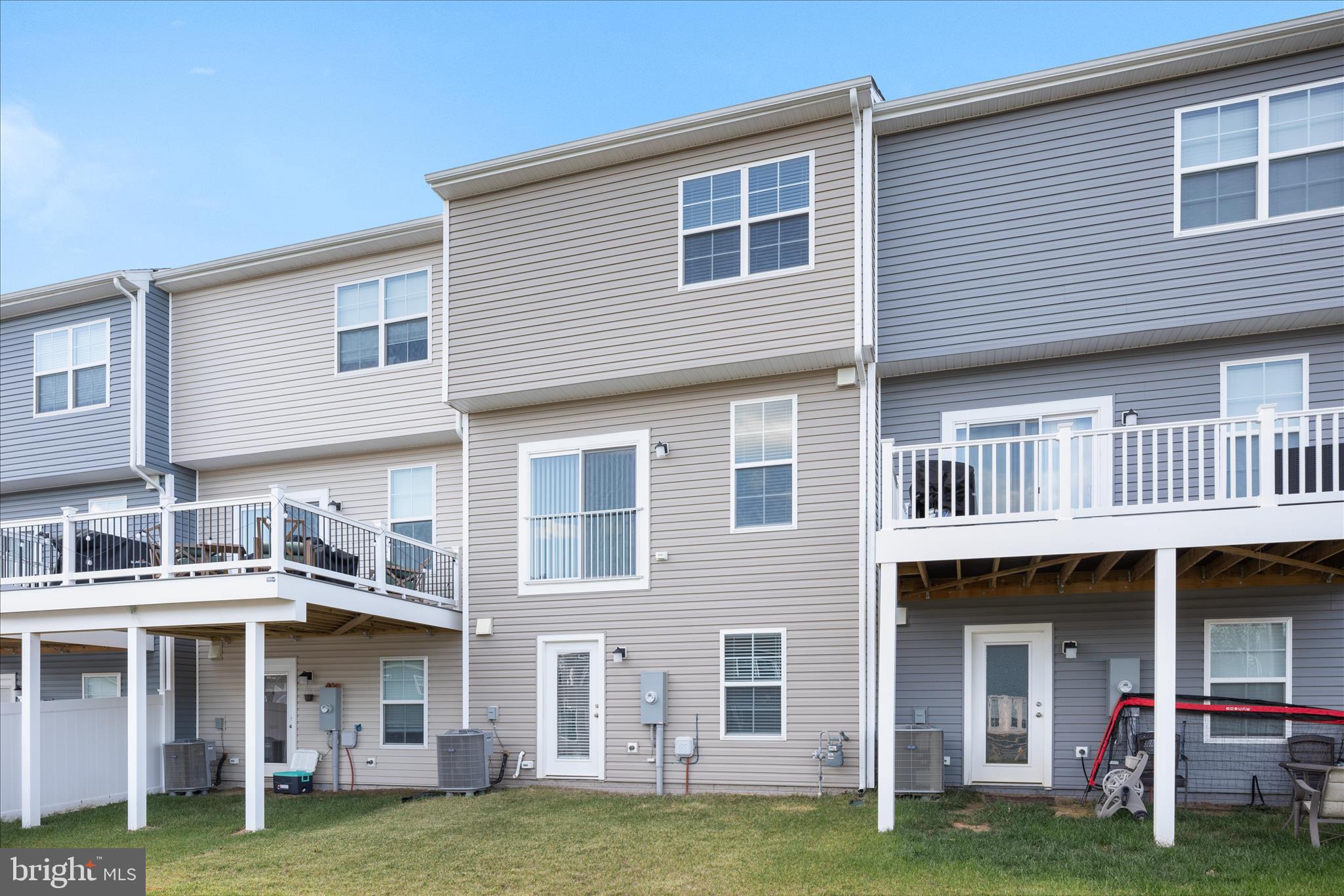 140 Tye Court Winchester, VA 22602 - Photo 28 of 31 a front view of a building with a garden
