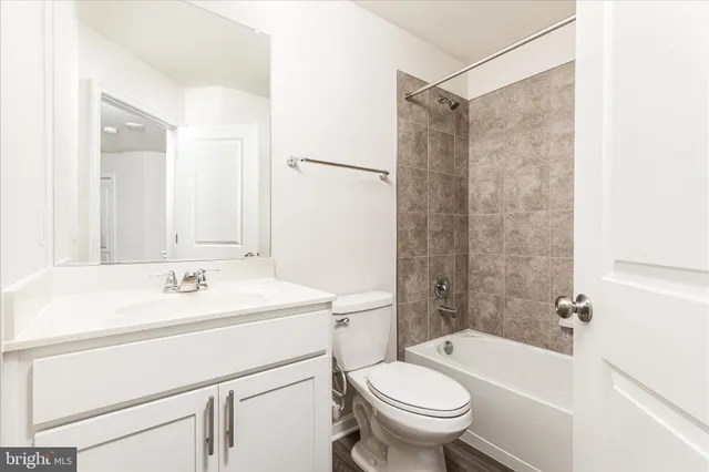 a bathroom with a sink a toilet and a bathtub