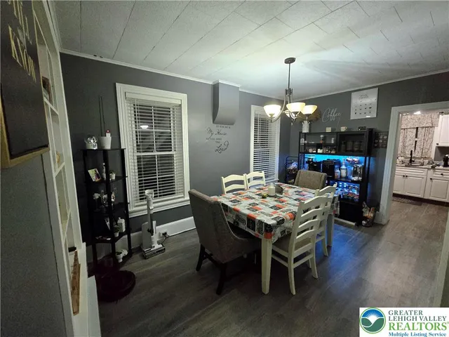 a kitchen with a table and chairs in it