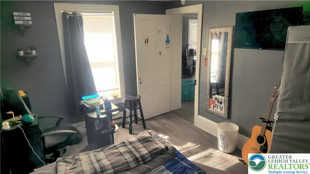 a living room with furniture windows and a table