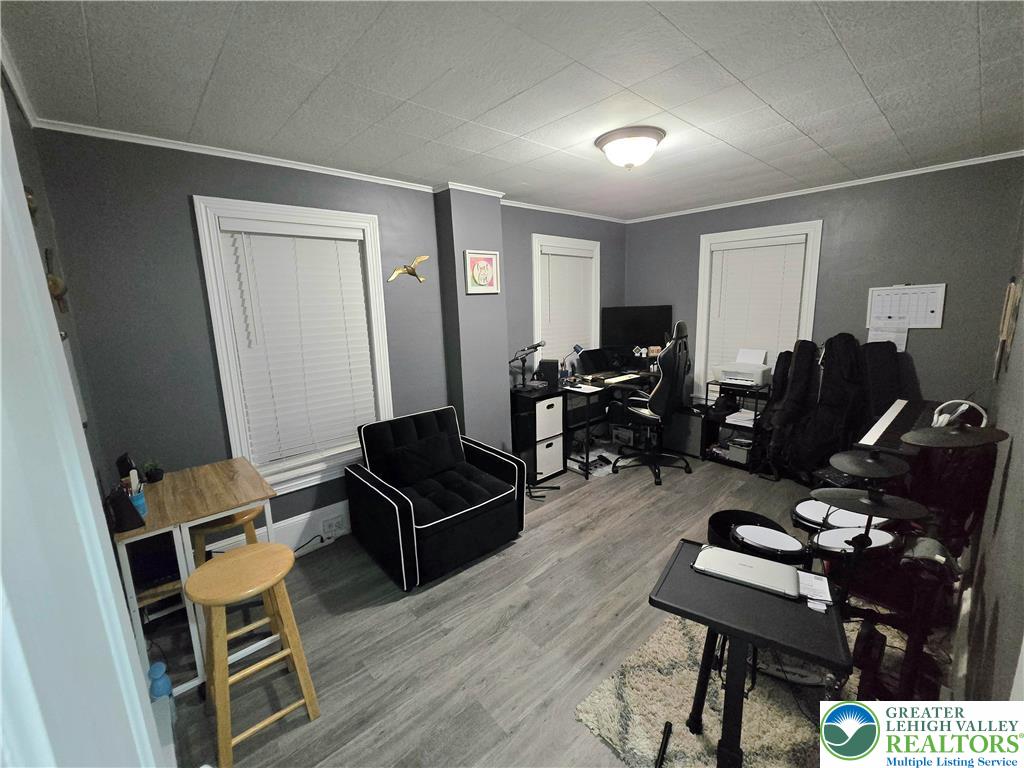 129 Rattlesnake Hill Road Boyertown, PA 19512 - Photo 22 of 26 a living room with furniture a wooden floor and a window