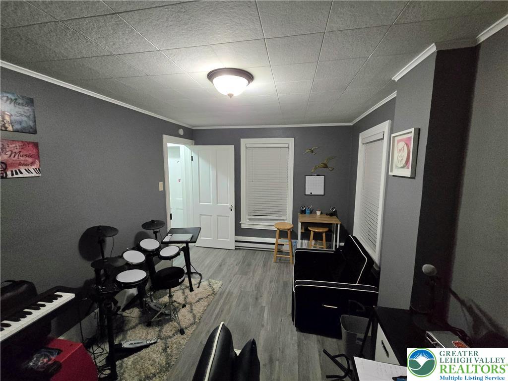 129 Rattlesnake Hill Road Boyertown, PA 19512 - Photo 23 of 26 a hallway with wooden floor and furniture