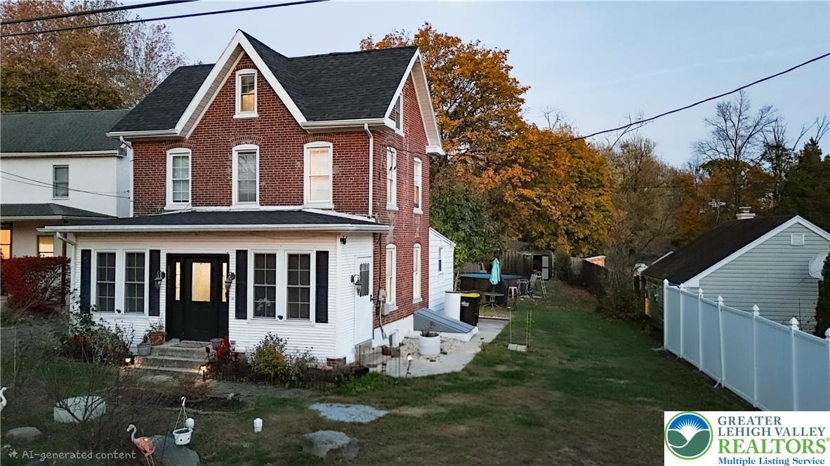 129 Rattlesnake Hill Road Boyertown, PA 19512 - Photo 4 of 26 a front view of a house with garden