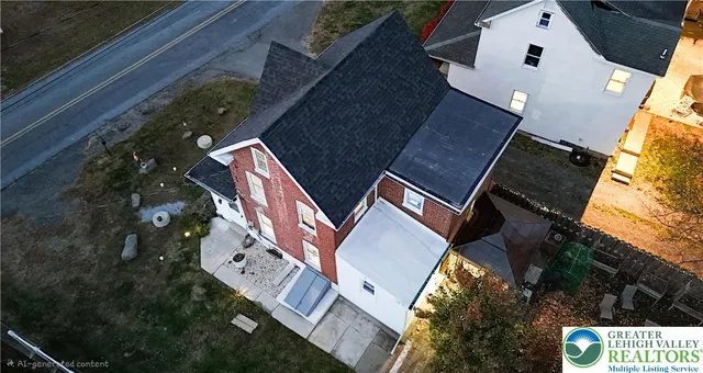 an aerial view of house with yard