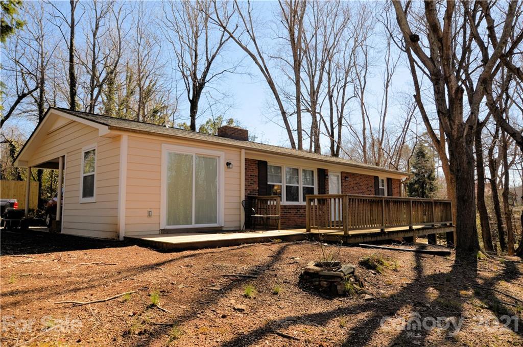 200 Bradshaw Road Tryon, NC 28782 - Photo 1 of 24 a front view of a house with a yard covered in snow