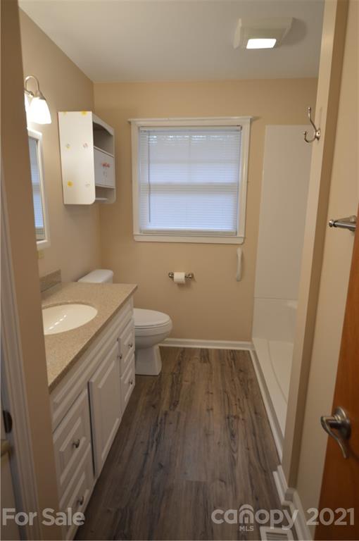 200 Bradshaw Road Tryon, NC 28782 - Photo 13 of 24 a bathroom with a granite countertop sink toilet and shower