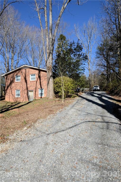 200 Bradshaw Road Tryon, NC 28782 - Photo 24 of 24 a view of a yard with car parked
