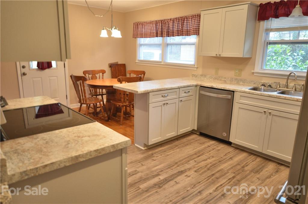 200 Bradshaw Road Tryon, NC 28782 - Photo 5 of 24 a kitchen with a sink a window and cabinets