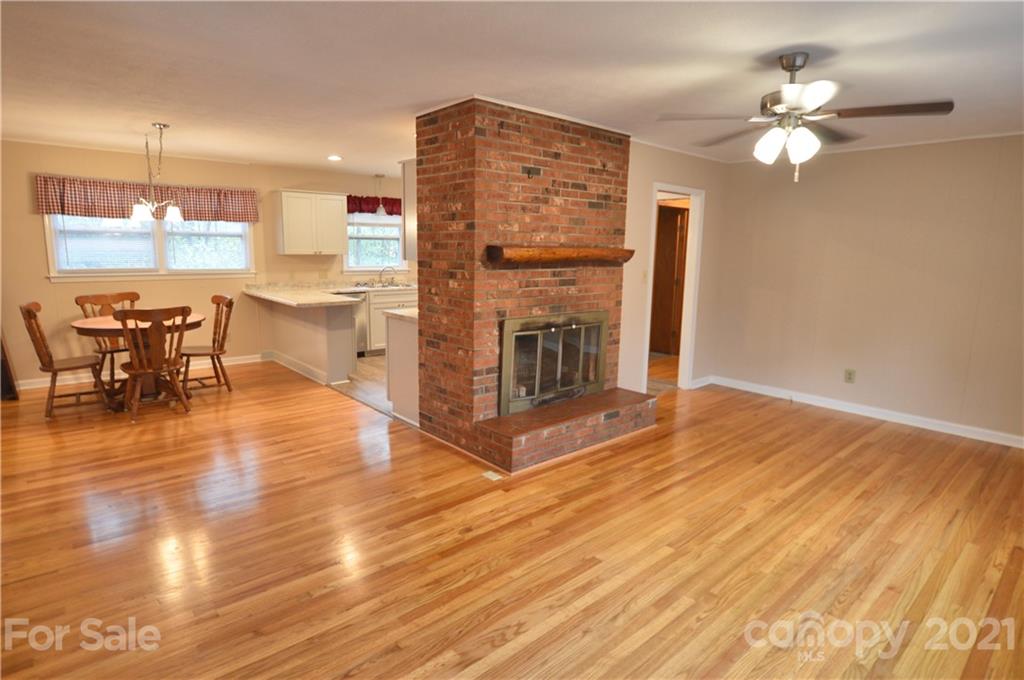 200 Bradshaw Road Tryon, NC 28782 - Photo 7 of 24 a view of a kitchen with furniture and wooden floor