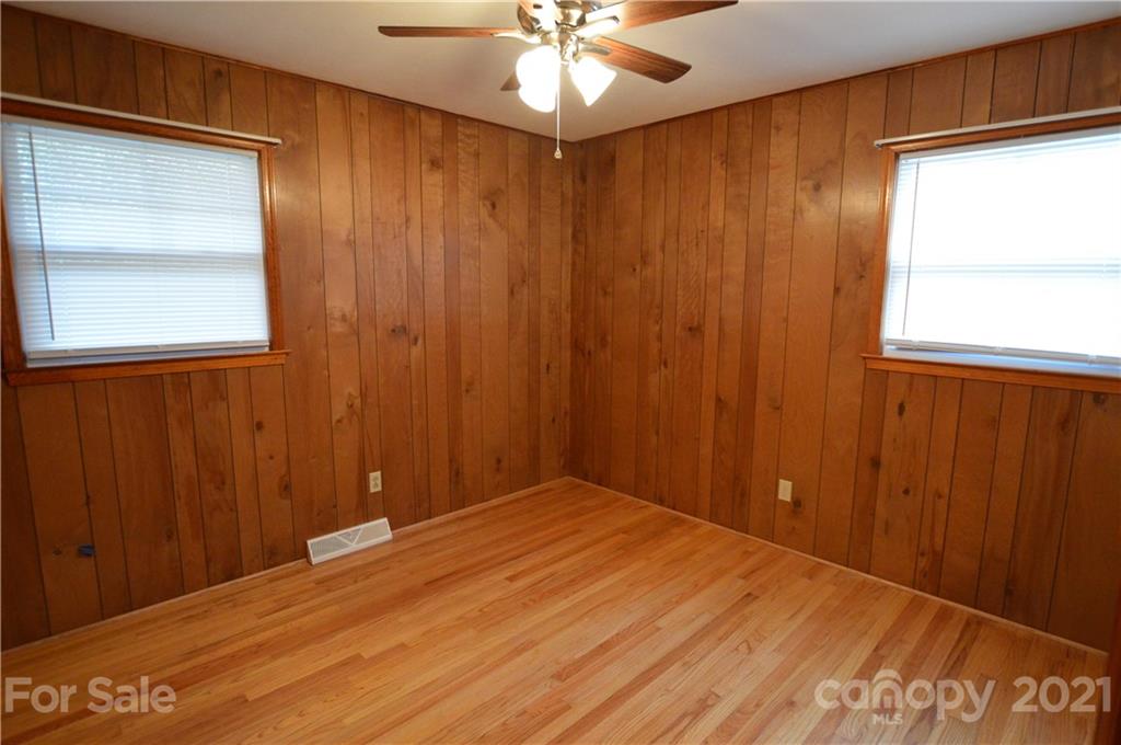 200 Bradshaw Road Tryon, NC 28782 - Photo 10 of 24 an empty room with a window and chandelier fan