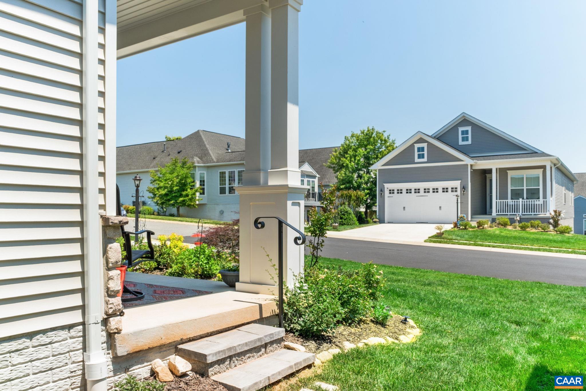124 Stodghill Drive Ruckersville, VA 22968 - Photo 43 of 58 a front view of a house with a yard and potted plants