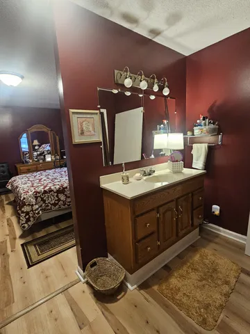 a bedroom with a bed and a tv on table