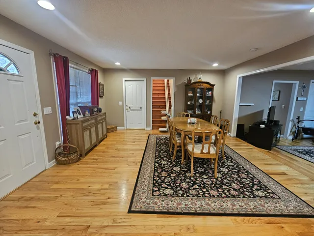 a room with wooden floor and furniture