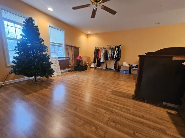 a bathroom with a toilet and a shower curtain