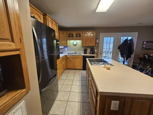 a room with wooden floors a table and chairs