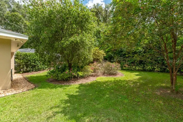 a house with trees in the background