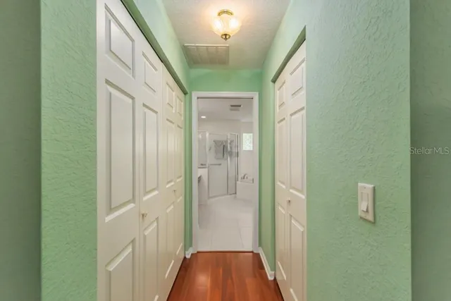 a kitchen with stainless steel appliances granite countertop a sink a stove and refrigerator