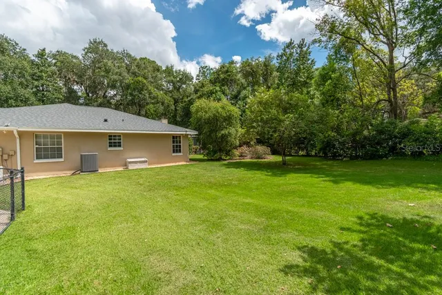 a view of a backyard of the house