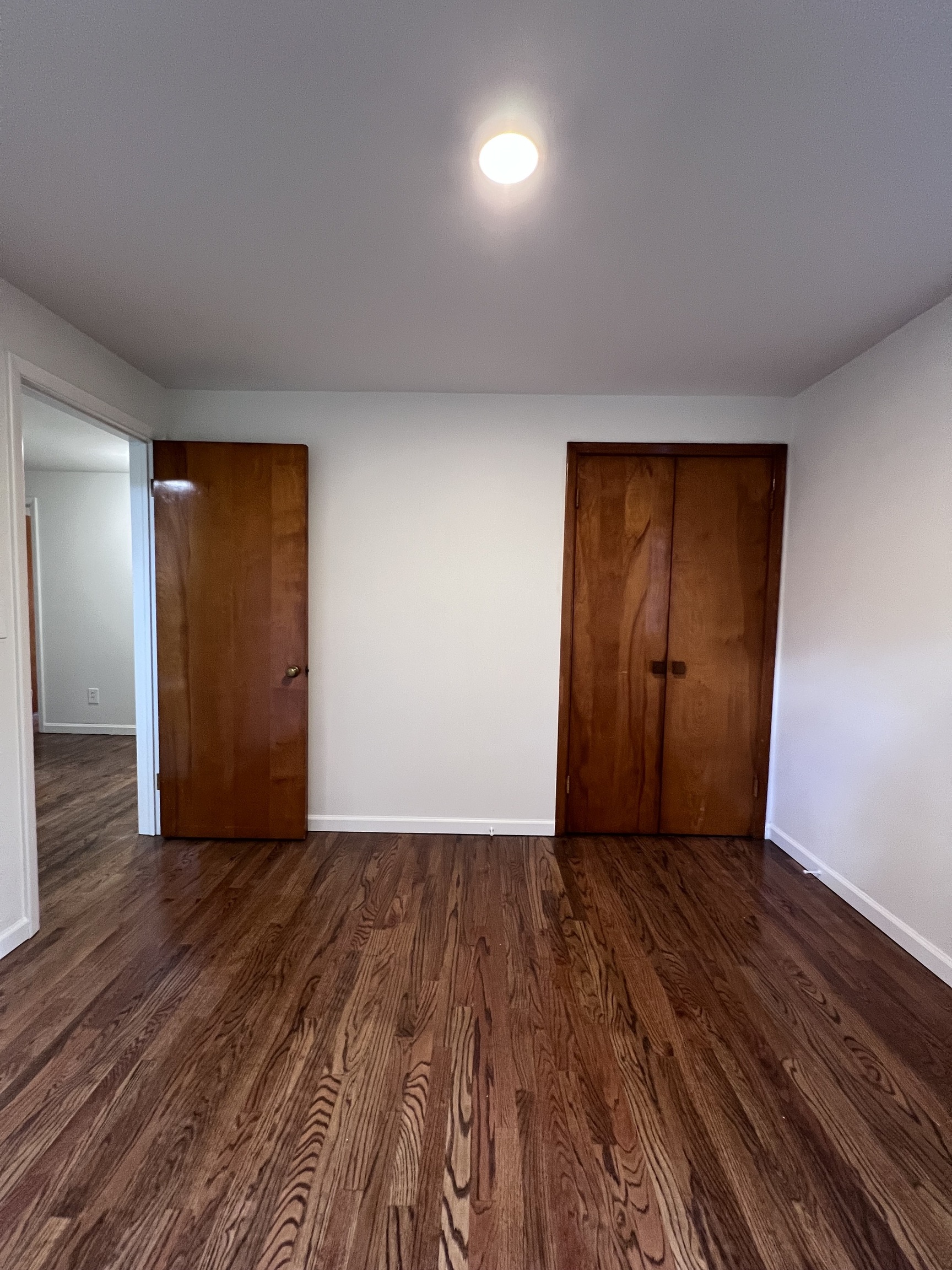 92 Birch Lane Naugatuck, CT 06770 - Photo 13 of 17 a view of an empty room with wooden floor and closet