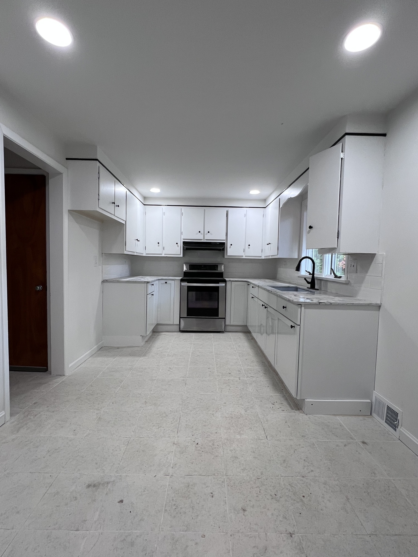 92 Birch Lane Naugatuck, CT 06770 - Photo 14 of 17 a kitchen with stainless steel appliances granite countertop a sink and cabinets