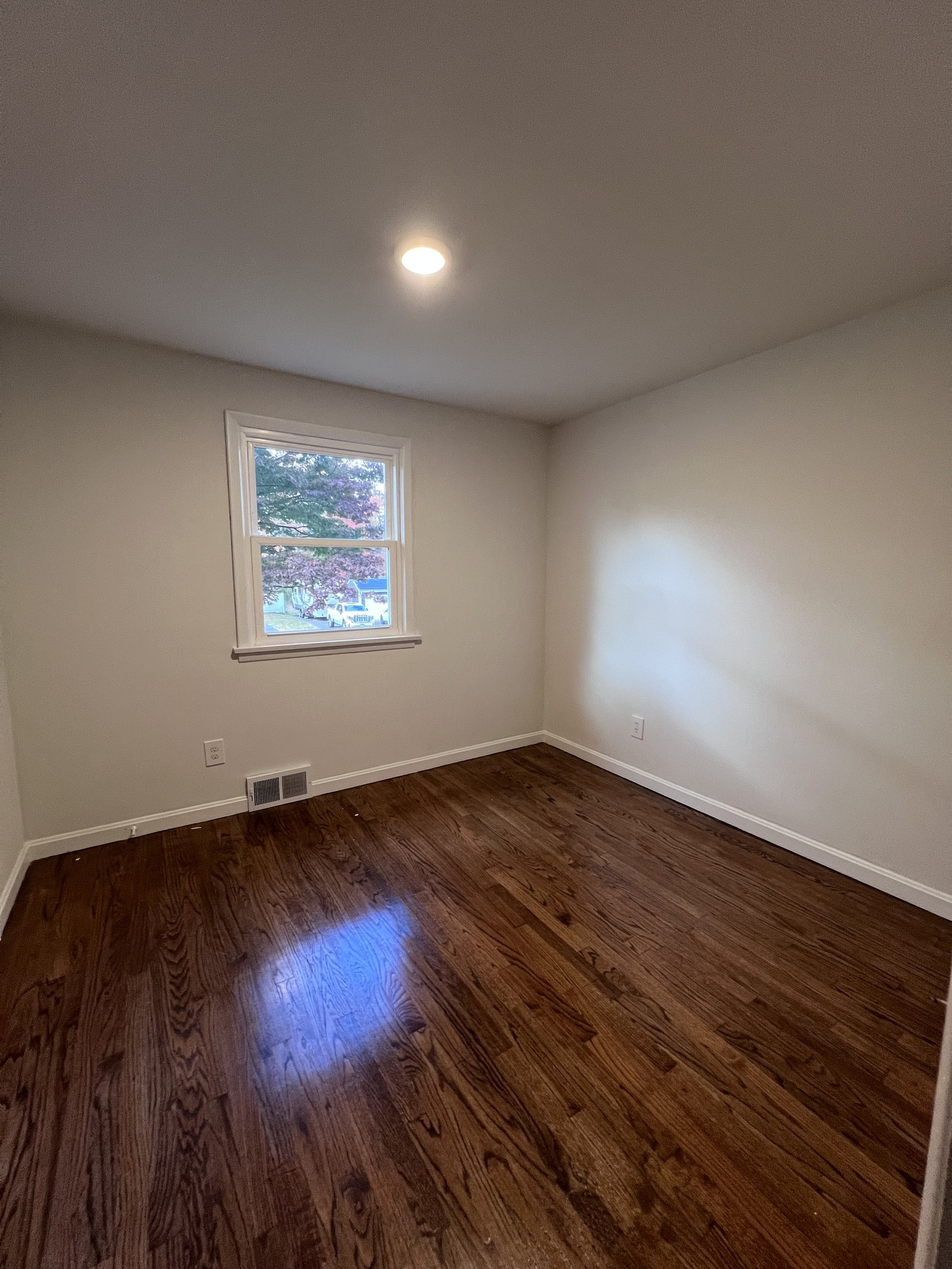 92 Birch Lane Naugatuck, CT 06770 - Photo 6 of 17 a view of an empty room and wooden floor