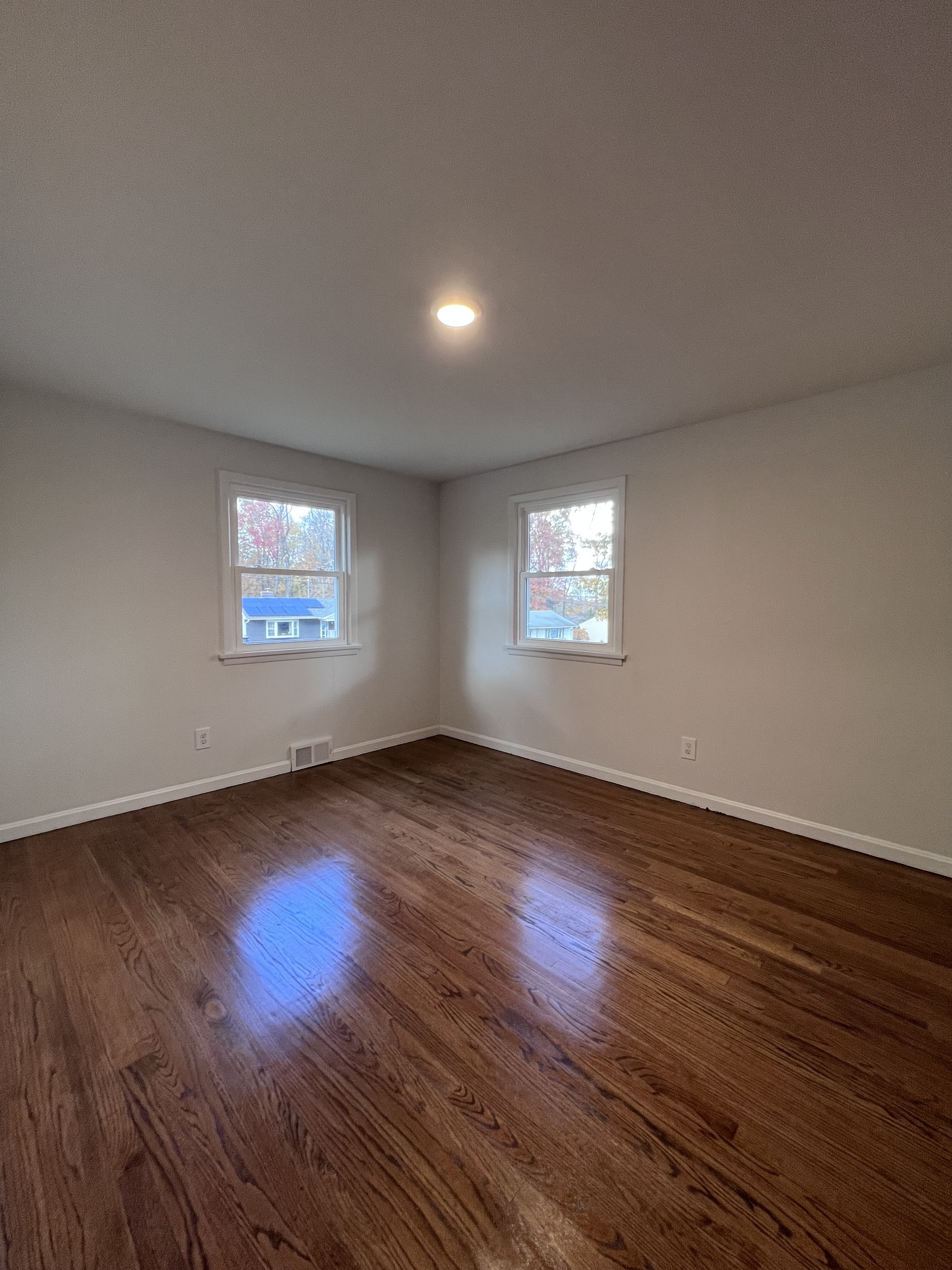 92 Birch Lane Naugatuck, CT 06770 - Photo 7 of 17 a view of an empty room with wooden floor and a window