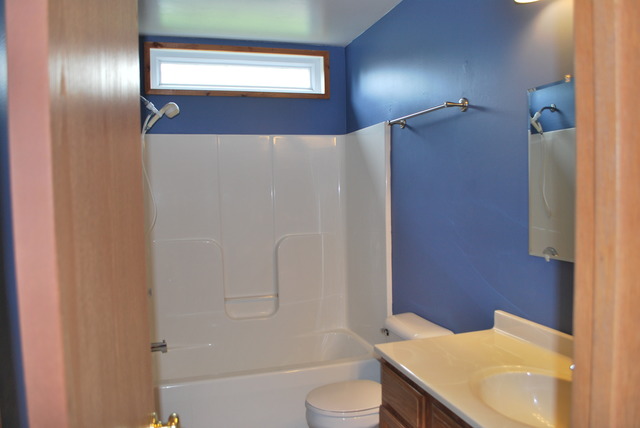 126 Windward Lane Rochelle, IL 61068 - Photo 14 of 25 a bathroom with a sink toilet and shower