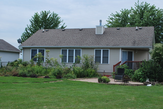 126 Windward Lane Rochelle, IL 61068 - Photo 21 of 25 a house view with a garden space