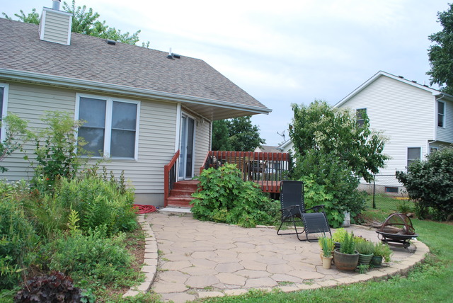 126 Windward Lane Rochelle, IL 61068 - Photo 22 of 25 a front view of a house with garden
