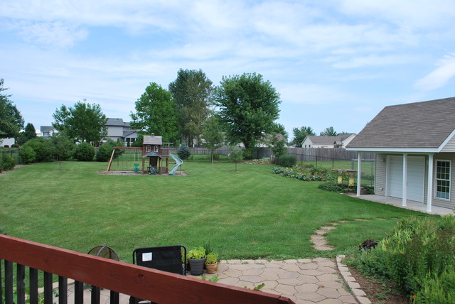 126 Windward Lane Rochelle, IL 61068 - Photo 24 of 25 a view of a backyard with sitting area