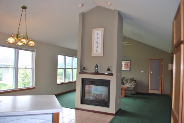 126 Windward Lane Rochelle, IL 61068 - Photo 9 of 25 a living room with furniture and a fireplace